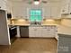 Efficient kitchen features white cabinets, modern appliances, and ample counter space at 2130 Vashti Rd, Taylorsville, NC 28681