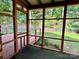 Cozy screened-in porch providing a relaxing space with scenic views of the backyard at 2130 Vashti Rd, Taylorsville, NC 28681