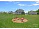 Expansive backyard features a charming fire pit area, perfect for outdoor gatherings and relaxation at 224 Hidden Meadows Dr, Mooresville, NC 28117