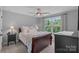 Cozy bedroom featuring a ceiling fan, a window that lets in plenty of natural light, and neutral wall paint at 224 Hidden Meadows Dr, Mooresville, NC 28117