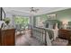 Comfortable bedroom with a tray ceiling, large window, and stylish furnishings at 224 Hidden Meadows Dr, Mooresville, NC 28117