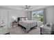 Bright bedroom with a large window, neutral walls, and comfortable bedding showcasing a peaceful ambiance at 224 Hidden Meadows Dr, Mooresville, NC 28117