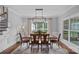 Formal dining room features a modern chandelier, large window, and stylish decor at 224 Hidden Meadows Dr, Mooresville, NC 28117