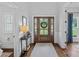 Welcoming foyer with hardwood floors, elegant front door, and ample natural light at 224 Hidden Meadows Dr, Mooresville, NC 28117
