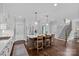 Open kitchen with a large center island, pendant lighting, and stainless steel appliances at 224 Hidden Meadows Dr, Mooresville, NC 28117