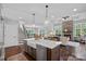 Gourmet kitchen with large island and bar seating that opens to the main living area at 224 Hidden Meadows Dr, Mooresville, NC 28117