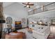 Bright living room boasts high ceilings, balcony, and open floor plan to the gourmet kitchen at 224 Hidden Meadows Dr, Mooresville, NC 28117