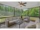 Cozy screened-in porch with comfortable seating and nature views at 224 Hidden Meadows Dr, Mooresville, NC 28117