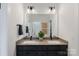 Double vanity bathroom features modern fixtures and a large mirror at 2529 Mabel Ln, Monroe, NC 28110