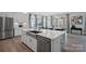 Modern kitchen featuring a large island, stainless steel appliances, and hardwood flooring at 2529 Mabel Ln, Monroe, NC 28110