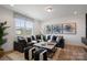 Cozy living room featuring a large sectional, decorative pillows, and a patterned area rug at 2529 Mabel Ln, Monroe, NC 28110