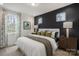 Comfortable primary bedroom with a neutral palette, decorative lamps, and an area rug at 2529 Mabel Ln, Monroe, NC 28110