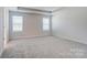 Neutral-toned carpeted bedroom with recessed lighting and a large window for natural light at 2648 Tillman St, Monroe, NC 28112