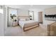 Comfortable bedroom features plush carpeting, two windows, and neutral decor at 3064 Ora Smith Rd, Lincolnton, NC 28092