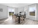 Sunlit dining room features modern decor, a large table, and a view to the outside at 3064 Ora Smith Rd, Lincolnton, NC 28092