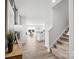 Bright foyer with light wood floors, staircase, and views of the living area at 3064 Ora Smith Rd, Lincolnton, NC 28092