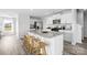 Modern kitchen with white cabinets, granite countertops, stainless steel appliances, and a center island at 3064 Ora Smith Rd, Lincolnton, NC 28092