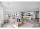 Open concept living room and kitchen with a center island, stainless steel appliances, and bar stool seating at 3064 Ora Smith Rd, Lincolnton, NC 28092