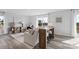 Bright living room with neutral decor, large windows, and a desk area with bar stools at 3064 Ora Smith Rd, Lincolnton, NC 28092