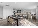 Open-concept living and dining area filled with natural light, showcasing modern décor and stylish furnishings at 3064 Ora Smith Rd, Lincolnton, NC 28092