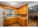 Charming kitchen features warm wood cabinets, a window over the sink, and hardwood floors at 3120 7Th Street Ne Dr, Hickory, NC 28601
