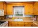 Bright kitchen offers ample counter space and a sink with a window view at 3120 7Th Street Ne Dr, Hickory, NC 28601