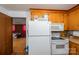 Functional kitchen with white appliances, including a refrigerator, oven, and microwave at 3120 7Th Street Ne Dr, Hickory, NC 28601
