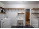 Laundry room featuring shelves, washer, dryer, wash tub, and painted floors at 3120 7Th Street Ne Dr, Hickory, NC 28601