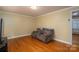 Living room featuring wood floors and a brown couch at 3120 7Th Street Ne Dr, Hickory, NC 28601