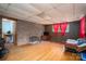 Finished rec room with brick accent wall, hardwood floors, and natural light from the window, great for entertaining at 3120 7Th Street Ne Dr, Hickory, NC 28601