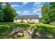 Large backyard with firepit and chairs, perfect for entertaining and relaxation at 321 Woodcrest Dr, York, SC 29745
