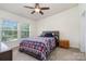Cozy bedroom featuring a ceiling fan, plush carpet, and a brightly lit window at 321 Woodcrest Dr, York, SC 29745