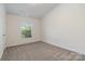 Cozy bedroom featuring plush carpet and a brightly lit window at 321 Woodcrest Dr, York, SC 29745