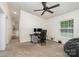 Versatile bedroom featuring plush carpet, a ceiling fan, and a brightly lit window at 321 Woodcrest Dr, York, SC 29745