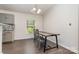 Bright dining area featuring luxury vinyl plank flooring and a modern light fixture at 321 Woodcrest Dr, York, SC 29745