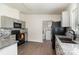 Updated kitchen featuring granite countertops, modern appliances, and stylish backsplash at 321 Woodcrest Dr, York, SC 29745
