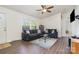 Comfortable living room features modern furniture, a ceiling fan, and ample natural light at 321 Woodcrest Dr, York, SC 29745