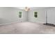 Spacious bedroom featuring a ceiling fan and two windows at 352 18Th Ne Ave, Hickory, NC 28601