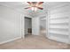 Well-lit bedroom featuring a built-in bookcase and closet at 352 18Th Ne Ave, Hickory, NC 28601