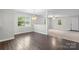 View of the dining room showcasing hardwood flooring, pendant lighting, and access to the living area at 352 18Th Ne Ave, Hickory, NC 28601