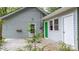 Home exterior featuring gray siding, a green door, and a wooden deck at 352 18Th Ne Ave, Hickory, NC 28601