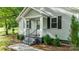 Close up of gray house with black shutters and a short walkway to the front door and front yard at 352 18Th Ne Ave, Hickory, NC 28601