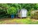 Outdoor storage shed surrounded by mature trees at 352 18Th Ne Ave, Hickory, NC 28601