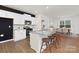 Bright, modern kitchen with white cabinets, a large island, and seating, perfect for entertaining and Gathering meals at 3952 Ashton Nw Dr, Conover, NC 28613