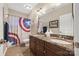 Bathroom featuring a double vanity with marble countertops and a large Captain America shower curtain at 405 Deer Brush Ln, Waxhaw, NC 28173