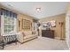 Comfortable bedroom with carpet, seating, and plenty of natural light at 405 Deer Brush Ln, Waxhaw, NC 28173