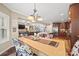 Open concept dining room leading to the kitchen, living room and staircase at 405 Deer Brush Ln, Waxhaw, NC 28173