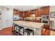 Modern kitchen with granite countertops, stainless steel appliances, and a breakfast bar at 405 Deer Brush Ln, Waxhaw, NC 28173