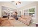 Open concept with vaulted ceilings including 2 sofas and access to the front entry at 405 Deer Brush Ln, Waxhaw, NC 28173