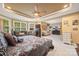Bright main bedroom with carpet, sitting area, and large windows at 405 Deer Brush Ln, Waxhaw, NC 28173